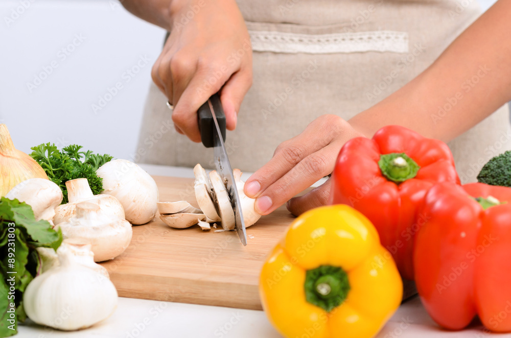 Close up of hands slicing vegetables with knife Close up of hands slicing vegetables with knife