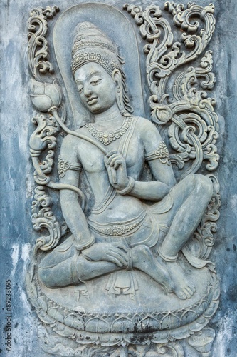 woman statue on the wall in temple   Thailand