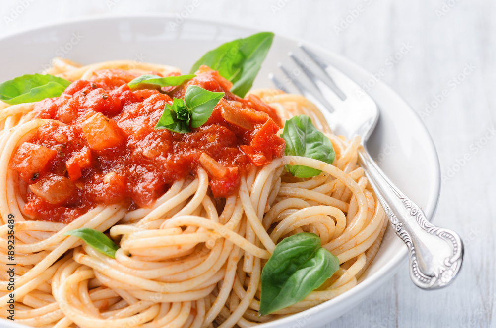 Pasta noodles with tomato sauce and basil Pasta noodles with tomato sauce and basil