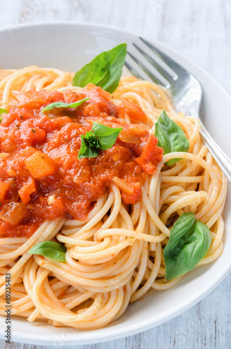 Spaghetti with tomato sauce and fresh basil herb