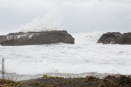 Stormy sea with waves crashing on rocks