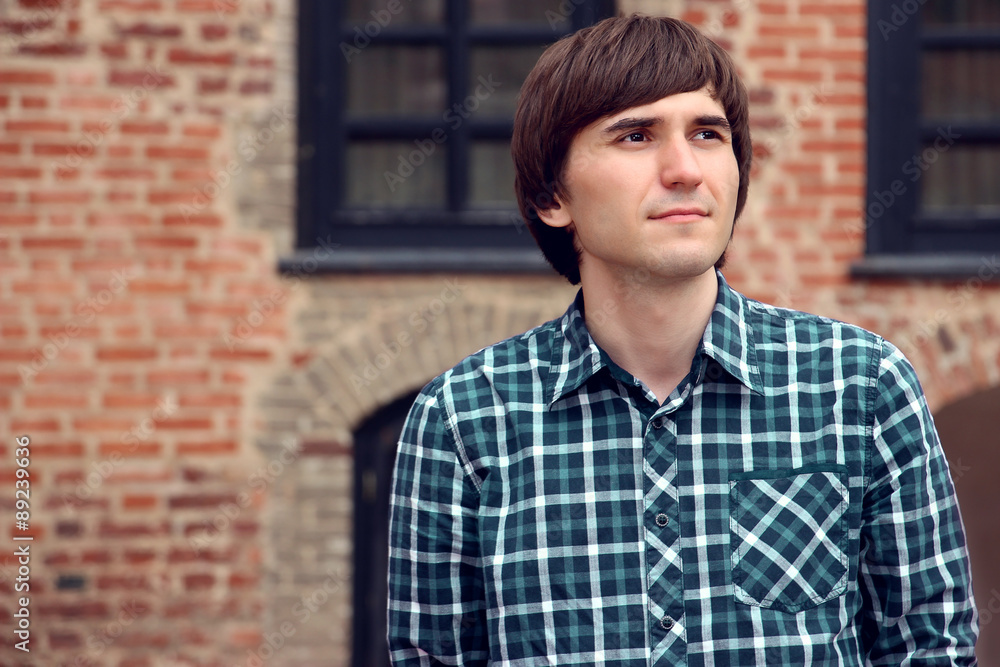 Portrait of young handsome man. Serious man. Student Portrait of young handsome man. Serious man. Student