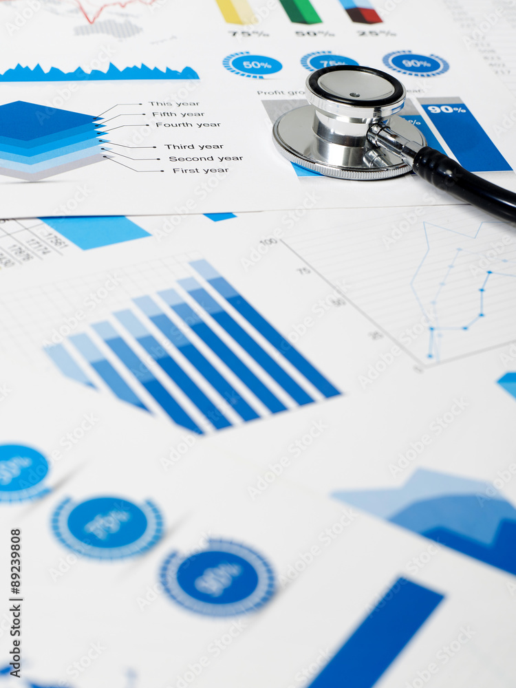 Fototapeta premium Stethoscope on chart papers