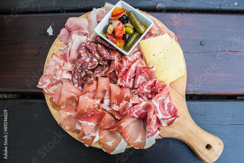 typical Italian appetizer with salami, cheese and pickles