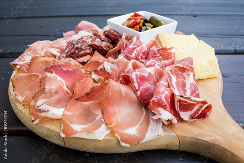 typical Italian appetizer with salami, cheese and pickles