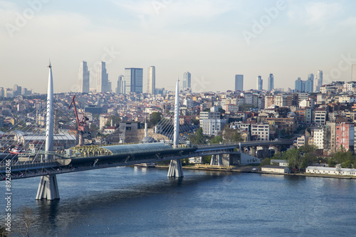 Golden Horn Metro Bridge with old and modern side of Istanbul background view during the day time. Lots of building and sea view of Istanbul