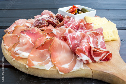 typical Italian appetizer with salami, cheese and pickles