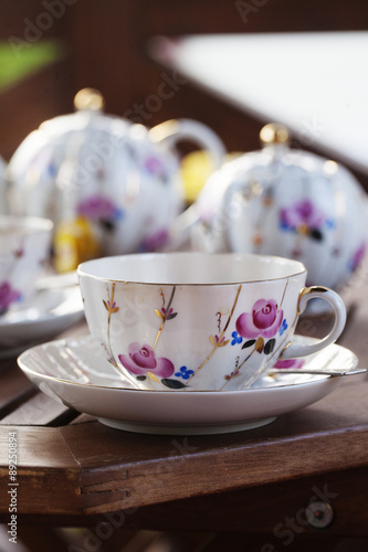 Tea set on terrace, vertical image 