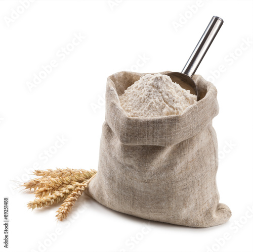 flour in a bag and spikelets isolated on white background