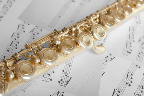 Flute on music notes background