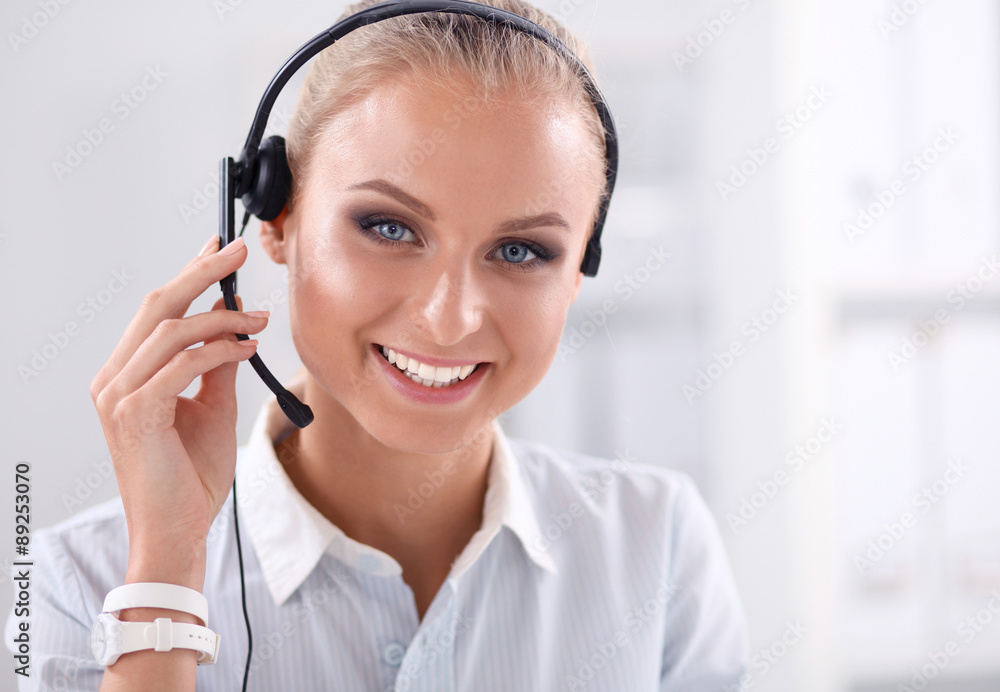 Close-up portrait of a customer service agent sitting at office Close-up portrait of a customer service agent sitting at office