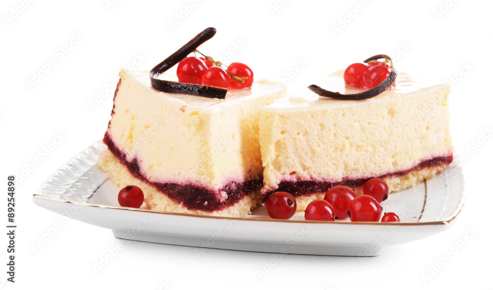 Tasty pieces of cheesecake with berries isolated on white Tasty pieces of cheesecake with berries isolated on white