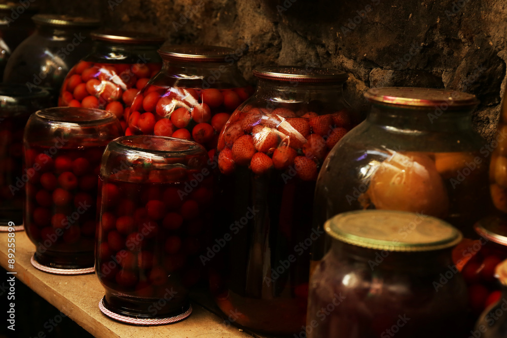 Home preservation in glass jars in cellar, closeup Home preservation in glass jars in cellar, closeup
