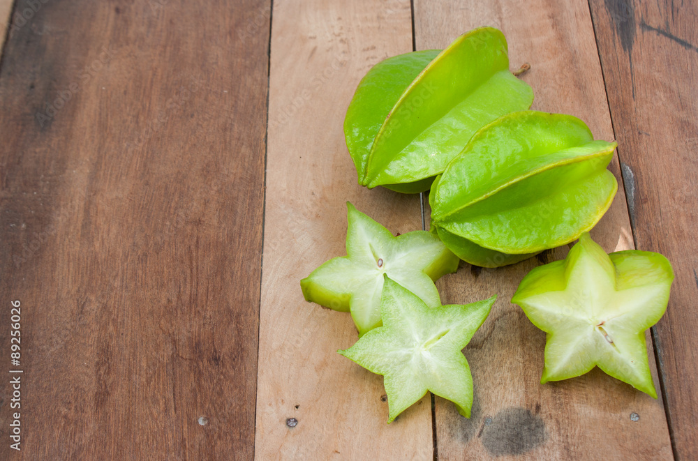 Carambola slices laid on old wood, the fruit season. Carambola slices laid on old wood, the fruit season.
