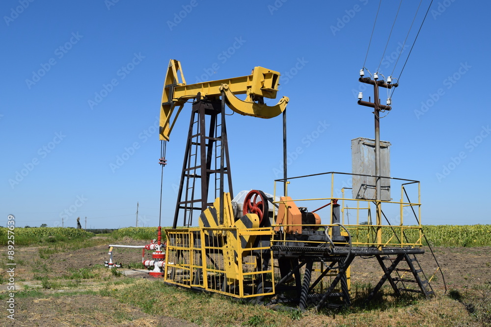 The pumping unit as the oil pump installed on a well The pumping unit as the oil pump installed on a well