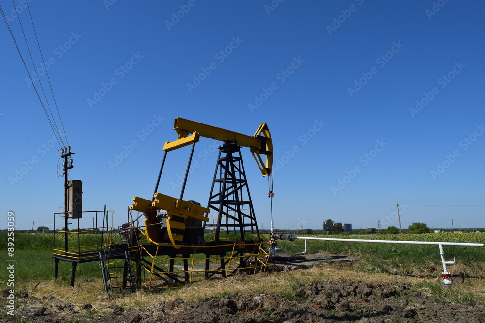 The pumping unit as the oil pump installed on a well The pumping unit as the oil pump installed on a well