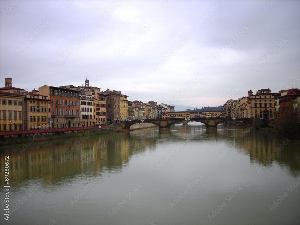 Beautiful renaissance architecture of Florence on the banks of river Arno on a clody day. Italy, Tuscany.