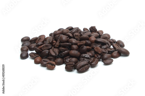 Brown coffee beans isolated on white background