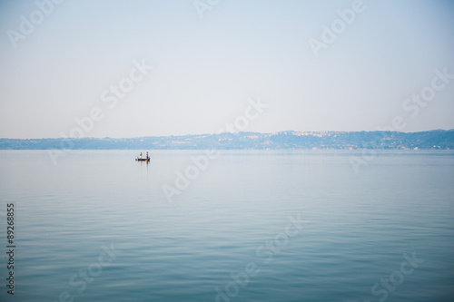 Boat on a lake in haze morning