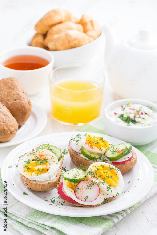 buns with boiled egg and vegetables for breakfast, vertical buns with boiled egg and vegetables for breakfast, vertical