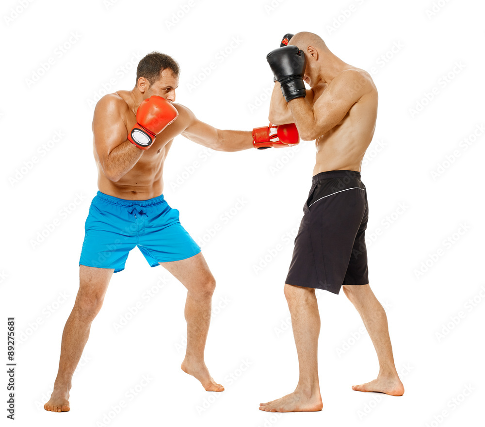 Kickboxers sparring on white Kickboxers sparring on white