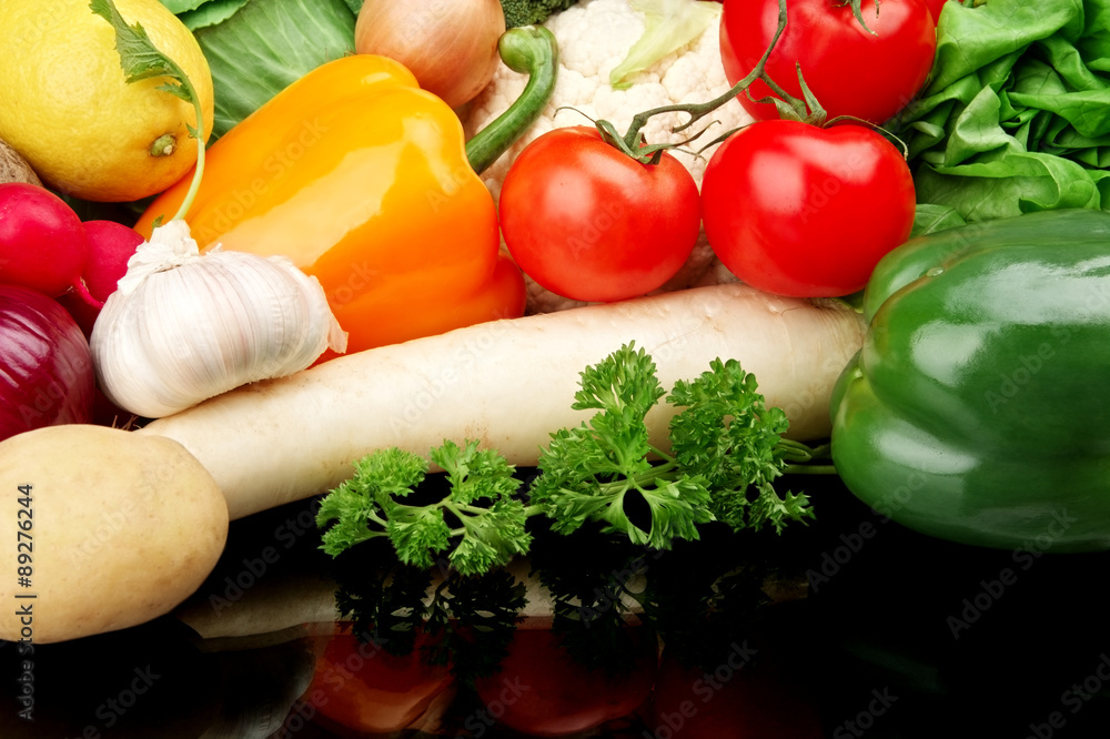 Group of different vegetables on black Group of different vegetables on black