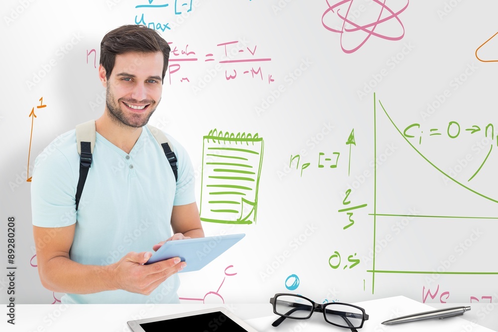 Composite image of student using tablet pc Composite image of student using tablet pc