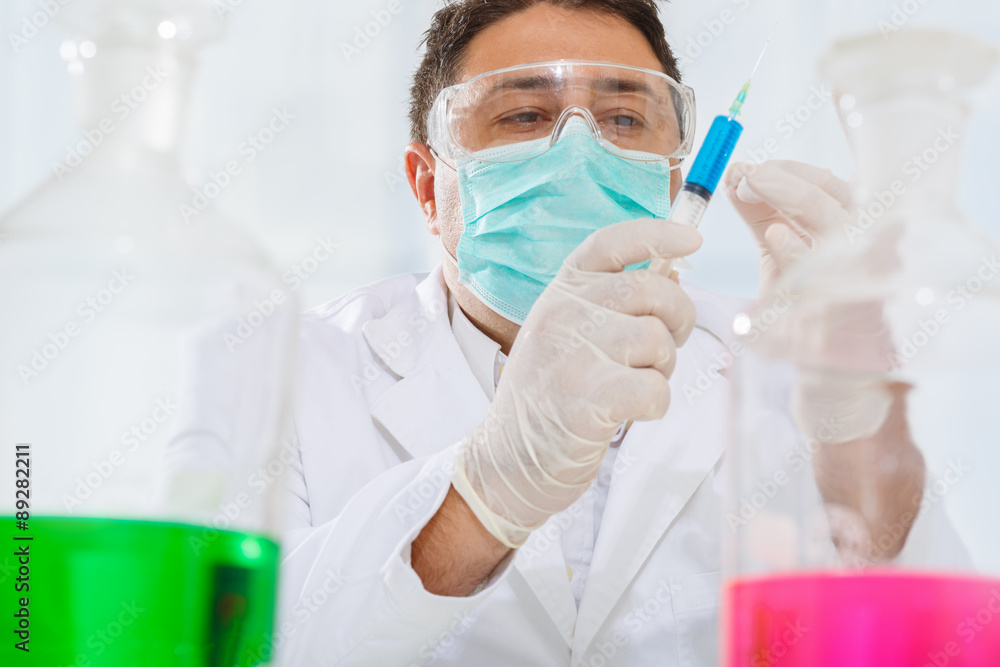 Scientist working with chemicals in the lab