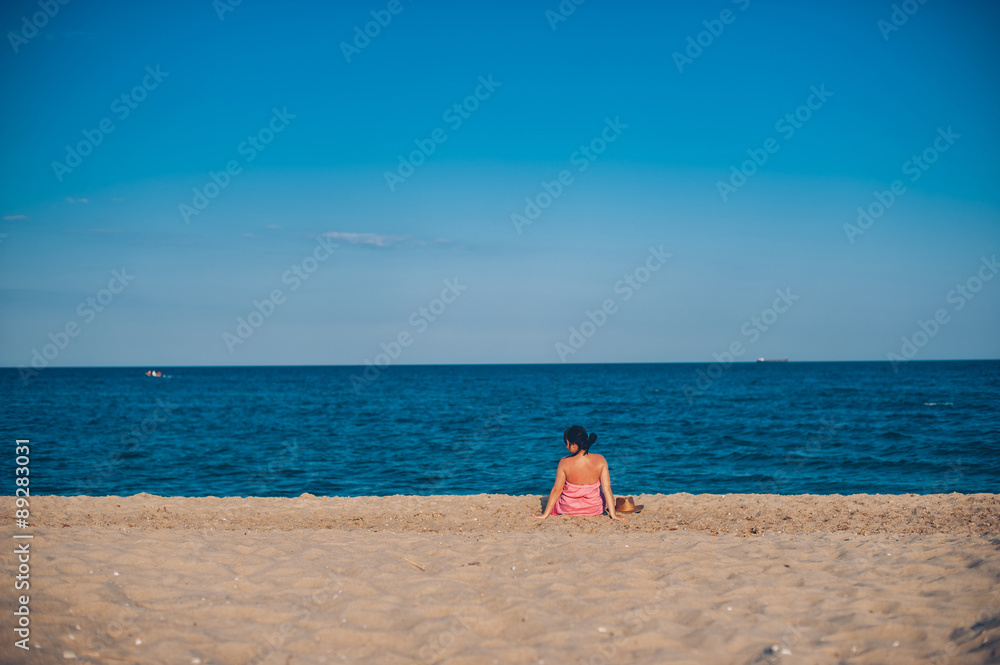 Young woman in summer dress with straw hat looking to a sky and Young woman in summer dress with straw hat looking to a sky and