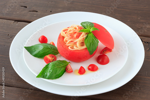 Cold spaghetti in tomato cup