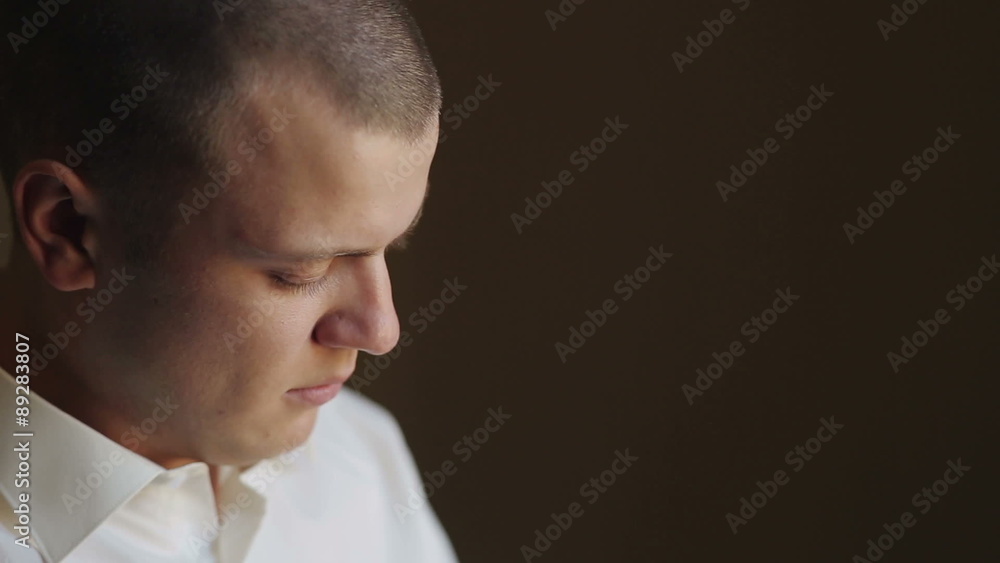 Man Puts on Cufflinks Man Puts on Cufflinks