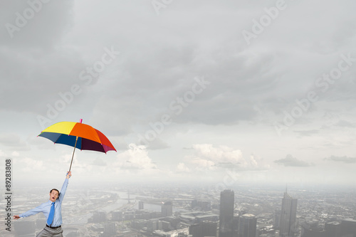 Man fly on umbrella