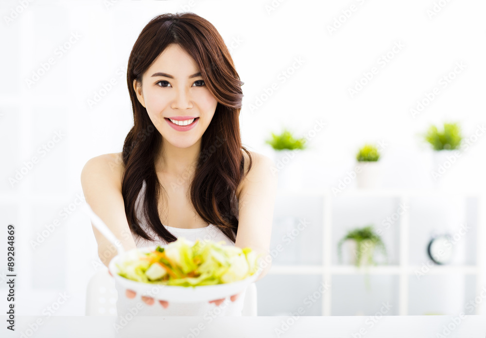 beautiful young woman eating and showing healthy food beautiful young woman eating and showing healthy food