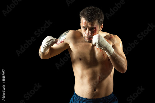 Portrait of aggressiv boxer in blood