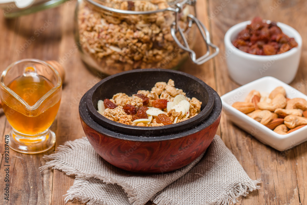 Granola, honey, nuts and raisins Granola, honey, nuts and raisins