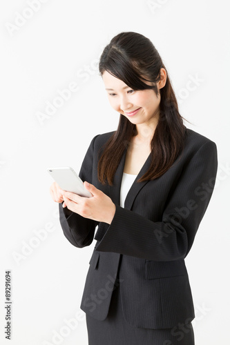 asian businesswoman using smart phone on white background