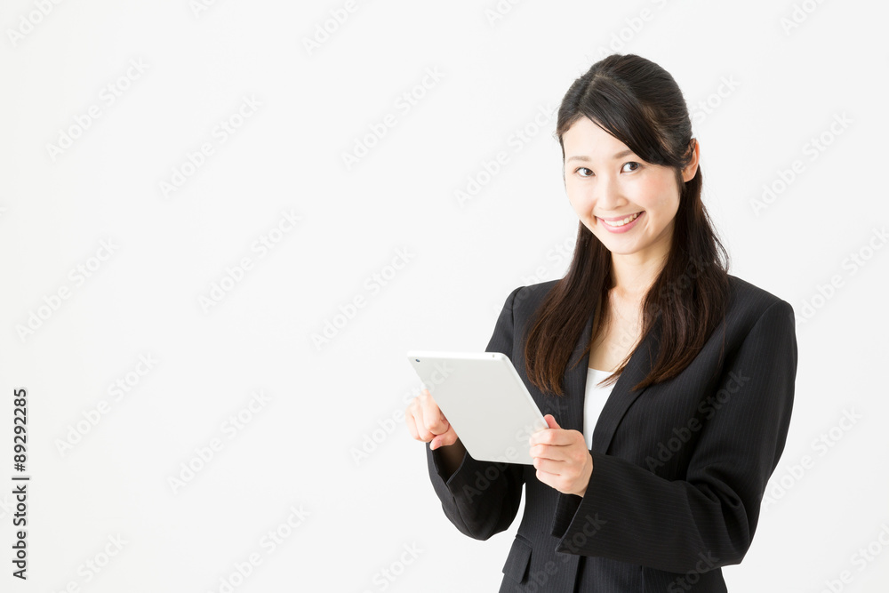 asian businesswoman using tablet computer on white background asian businesswoman using tablet computer on white background