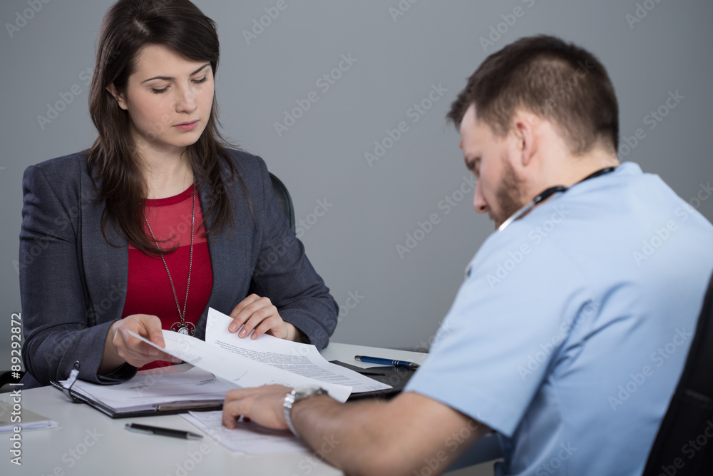 Boss of the hospital is talking with her employee Boss of the hospital is talking with her employee