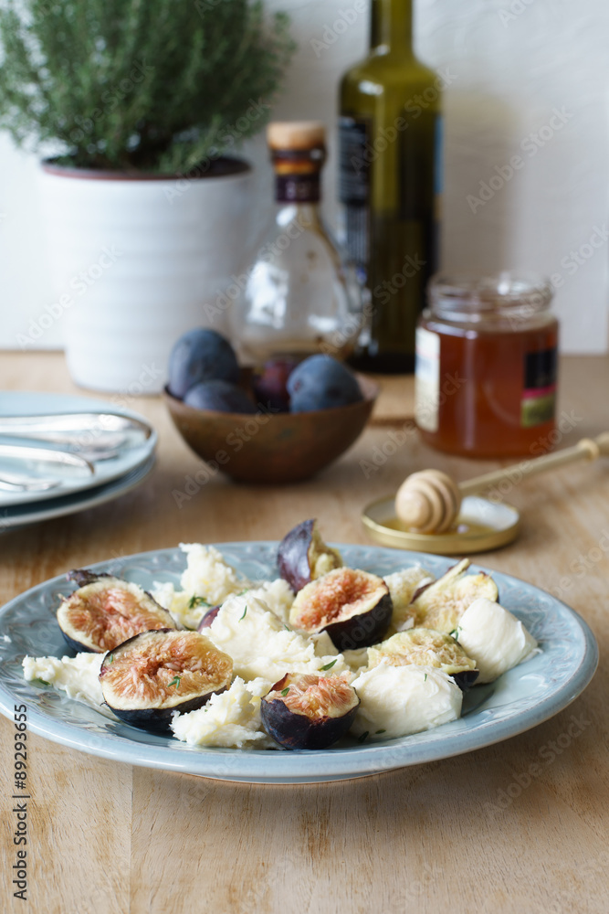 Starter of italian mozzarella cheese and fresh figs. Selective focus