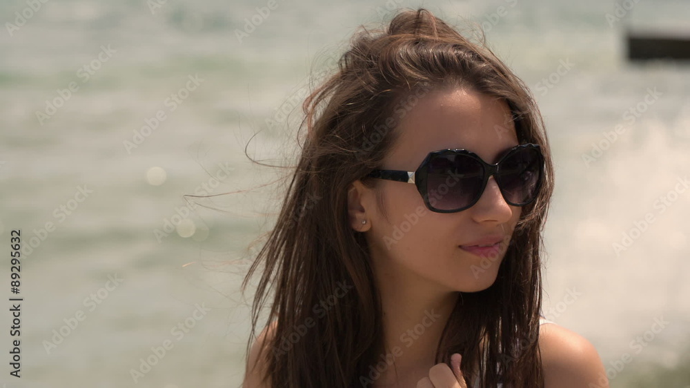 Portrait of a Pretty Woman With Glasses on the Beach Portrait of a Pretty Woman With Glasses on the Beach