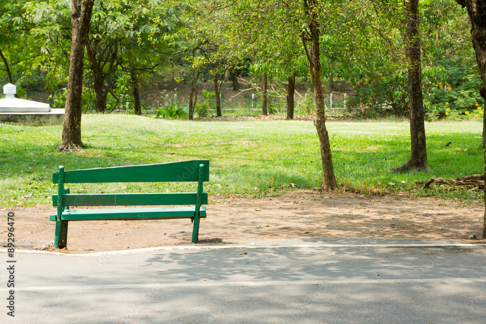 green bench in park green bench in park