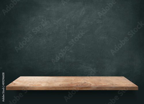 Wood table with blackboard background