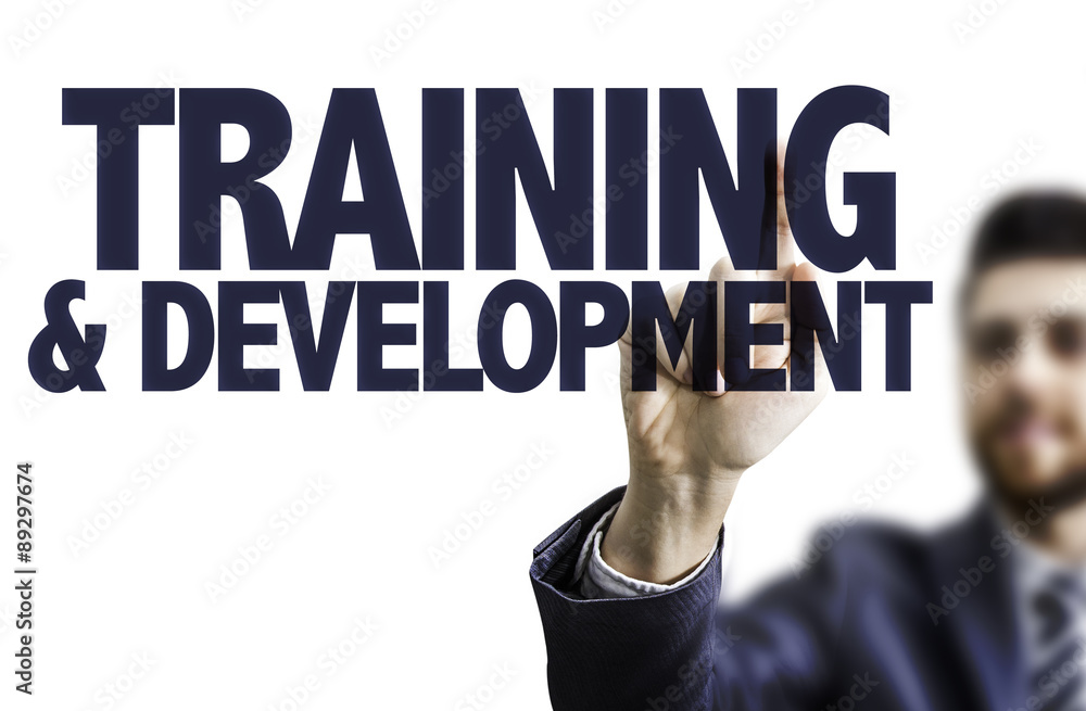 Business man pointing the text: Training & Development