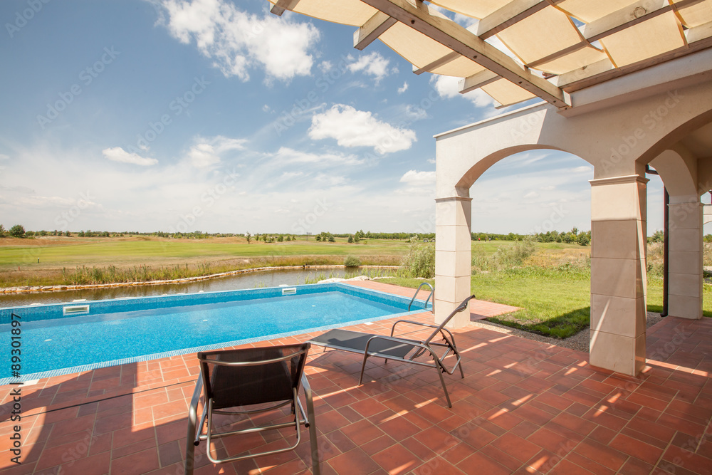Fototapeta premium swimming pool outside luxury home and beautiful view
