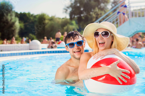 Beautiful couple in the swimming pool