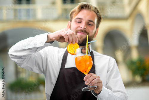 Barman making cocktail