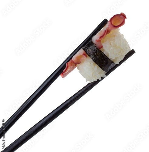 Eel sushi nigiri in chopsticks iolated on white background