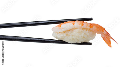 Shrimp sushi nigiri in chopsticks iolated on white background