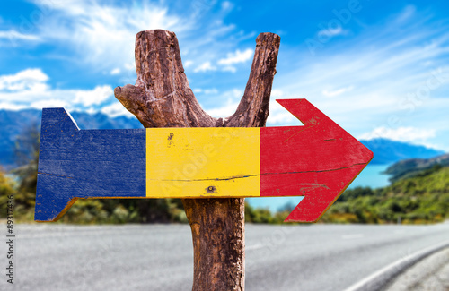 Romania Flag wooden sign with road background