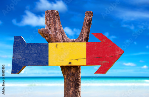 Romania Flag wooden sign with beach background